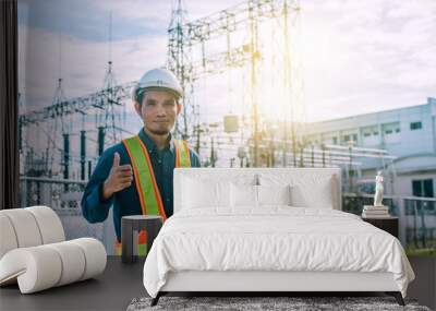 Engine Currently holding a tablet and a power plant with the Electricity Authority Wall mural