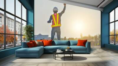 Happy man supervisor success project at construction site Wall mural