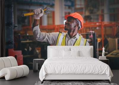 Portrait African American Black afro worker in factory, Cameroon Black man employee work in  production plant manufacture factory industry and operator line machine steel metal using helmet for safety Wall mural