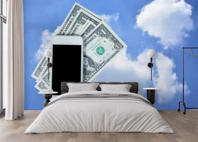 Smart phone dollar against blue sky clouds background Wall mural