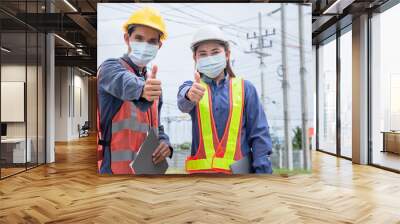 Two Asian Electrician on site service inspection power system station Wall mural