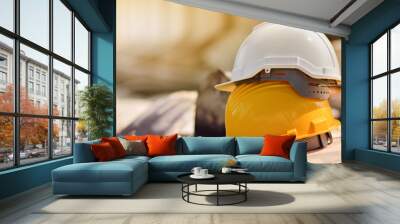 Yellow helmet hard hat  on wood floor in constriction site Wall mural