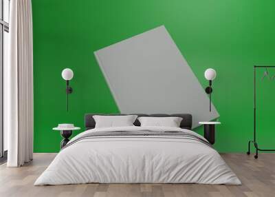 blank white book is on a green background, for your mockup design with light shadow. Wall mural