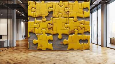 Incomplete jigsaw puzzle on wooden background, concept of problem-solving, challenge, and teamwork Wall mural