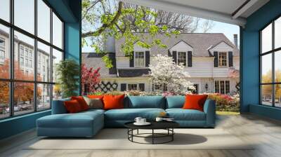 traditional upscale home with dogwood tree and azelea bushes - beautifully landscaped in springtime Wall mural