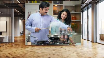 Asian Couple Cooking Together In Kitchen Wall mural