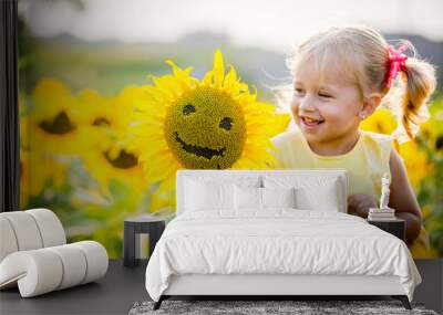 beautiful little girl in sunflowers Wall mural