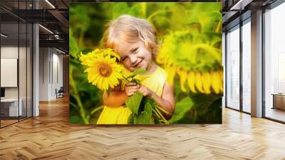 beautiful little girl in sunflowers Wall mural