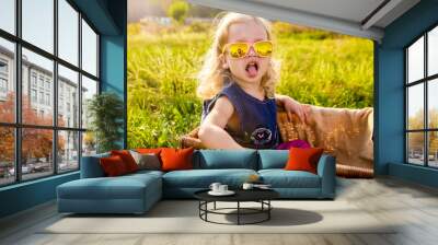 funny little girl in sunglasses Wall mural