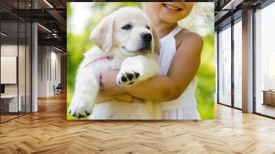 Little girl with a Golden retriever puppy Wall mural