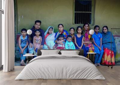 South asian combined family photo, a group of Bangladeshi hindu religious village people sitting outside home Wall mural