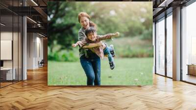 happy harmonious family outdoors concept.mother and son have activities together on holidays. Wall mural