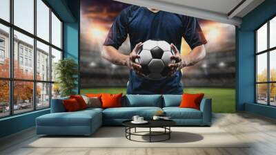 The concept of playing football.soccer player with Football on soccer field. Wall mural