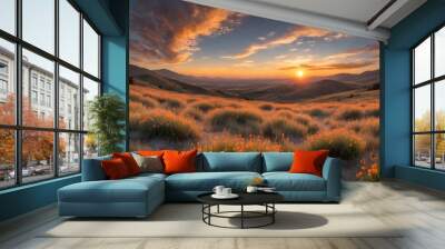 A stunning sunset over a field of wildflowers with rolling hills in the background. Wall mural