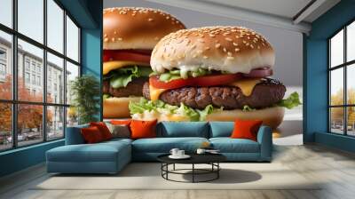 Two hamburgers with lettuce and tomato on top Wall mural