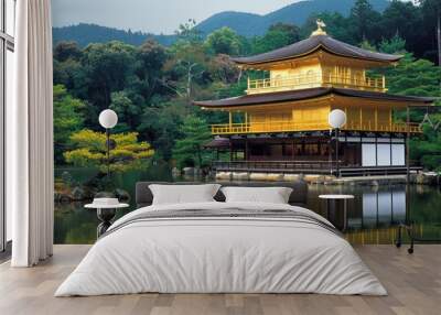 A stunning view of a temple in Kyoto, Japan, with sparkling gold leaf and a tranquil pond. Wall mural