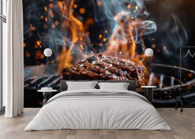 Grilled beef steak on stainless steel grill pot with flames on black background food and food concept Wall mural