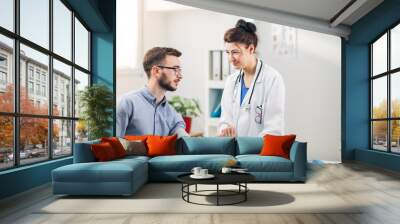 Doctor at her Medical Office with Patient Wall mural