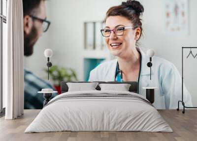 portrait of young woman doctor on the job Wall mural