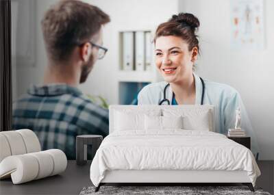 Woman Doctor prescribes medicine to Young Patient Wall mural