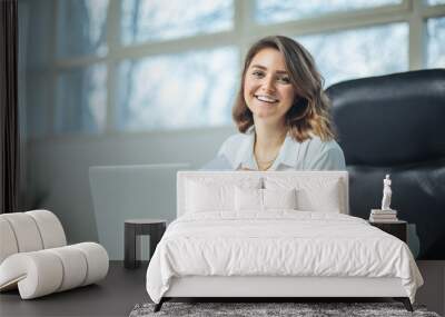 young woman in office working Wall mural