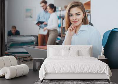 Young woman reading email Wall mural