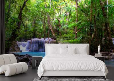 Erawan Waterfall idyllic in green forest and is rain forest Wall mural