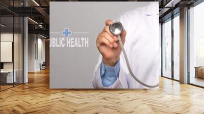 Doctor holding a stethoscope and word 