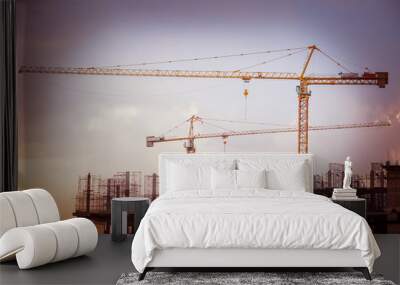 Construction site with cranes and scaffolding Wall mural