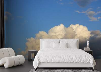 large rain cloud on clear blue sky background Wall mural