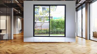 slide glass door with small garden landscaping in front of a new house Wall mural