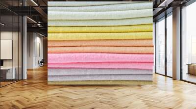 stack of colourful cotton clothes, close up pile of clothing Wall mural