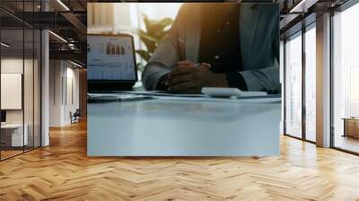 Close up of Business team analyzing income charts and graphs with modern laptop computer. Business analysis and strategy concept. Wall mural