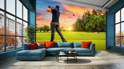 Golfer putting golf ball on the green golf, lens flare on sun set evening time, Golfer hitting golf shot with club on course while on summer vacation Wall mural