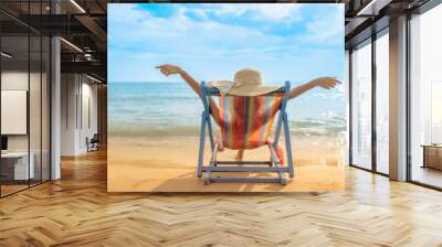 Summer beach vacation concept, Asia woman with hat relaxing and arm up on chair beach at Koh Mak, Trad, Thailand Wall mural