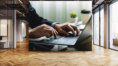 Business Professional in Suit Working Remotely on Laptop at Desk with Coffee and Notepad, Focusing on Productivity and Communication in a Modern Office or Home Workspace Wall mural