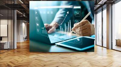 Businessman using laptop and analyzing economic growth, financial graph and business investment. planning strategy, stock market statistics, stock market trends, technical analysis strategy, value Wall mural