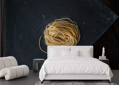 Fresh italian pasta on dark background Wall mural