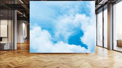 Blue sky background with tiny clouds. White fluffy clouds in the blue sky Wall mural