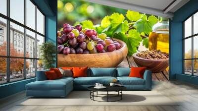 Closeup of grape seed in wooden bowl with antioxidant grape seed oil and fresh grape on the table Wall mural