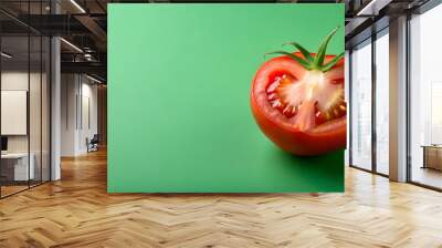 Fresh ripe tomato cut in half isolated on green background, floating fresh ripe tomato, tomato, half, isolated, green, background Wall mural