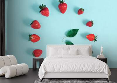 Creative layout made of summer fruits and leave. Minimal food concept of strawberries. Flat lay. Wall mural