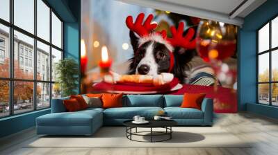 Close-up portrait of a dog wearing reindeer‘s horns celebrating Christmas. Bone on a plate as a treat on served holiday table. Christmas vibes Wall mural