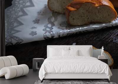 Fresh white bread whole, two sliced piece on the tablecloth, the plate on three cheese sandwich Wall mural