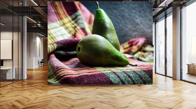 Two green sweet pears of the conference variety on a checkered napkin Wall mural