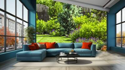 A flower garden in the backyard in the summer. Wall mural