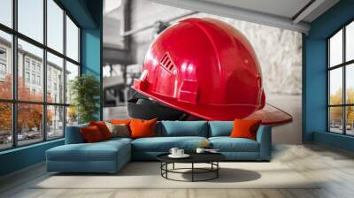 red hard hat on a table. Wall mural