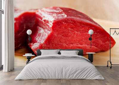 Raw beef filet Mignon steak on a wooden Board.  Wall mural