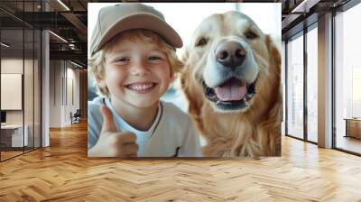 A charming young boy and his friendly golden retriever dog, both exuding joy and happiness as they pose for a picture together in bright, warm lighting. Wall mural