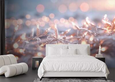 A close-up image of warm white fairy lights resting on a surface with a beautifully blurred background, creating a cozy and festive atmosphere perfect for any season. Wall mural